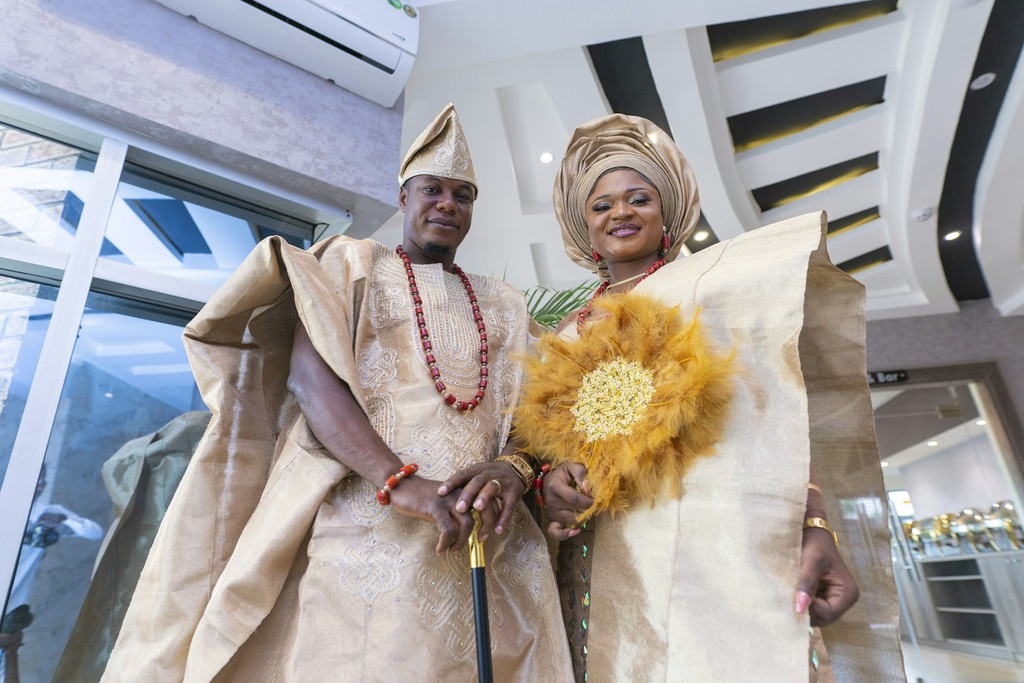 Stylish Nigerian wedding reception with vibrant guests